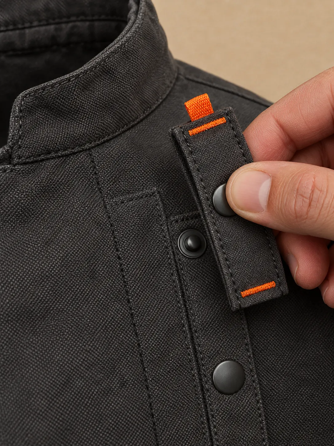 Mandarin Collar Chef Jacket, close-up of the snap rail and pull tab