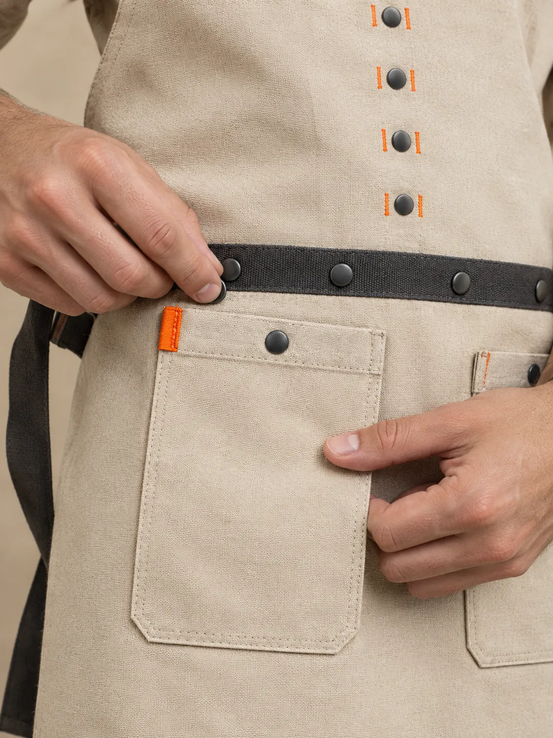 Painter's Studio Apron, close-up of the snap rail and pull tab