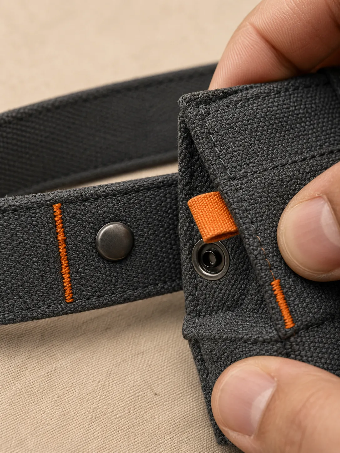 Rail Waist Belt, close-up of the snap rail and pull tab