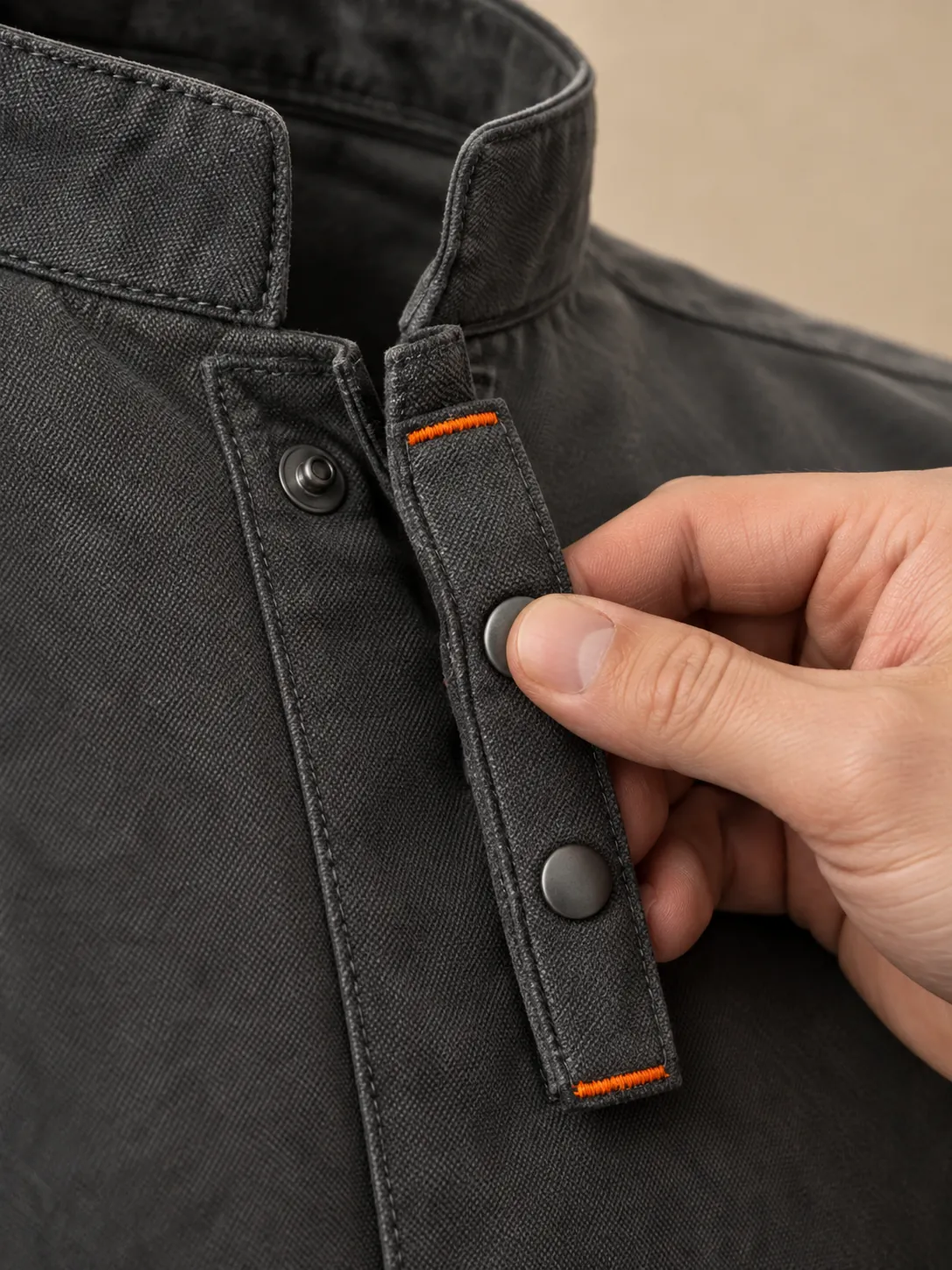 Snap-Front Chef Jacket, close-up of the snap rail and pull tab