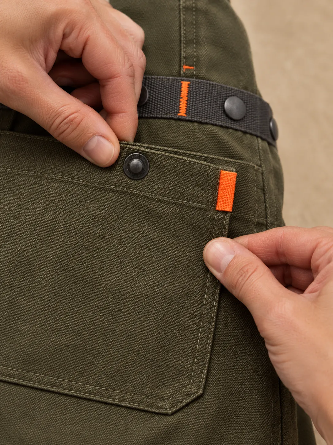 Wheel Studio Apron, close-up of the snap rail and pull tab
